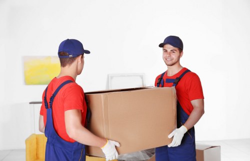 Removal team sorting recyclable items during a Holland Park move