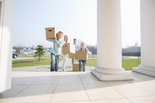 Family preparing for a house move with removalists in Holland Park