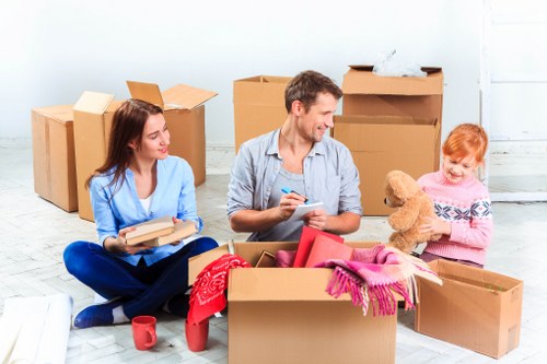 Professional movers handling a flat removal in Holland Park