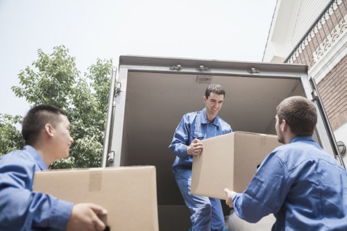 Professional removals team loading items safely for transport