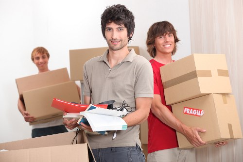 Packing and loading student belongings in a Holland Park flat