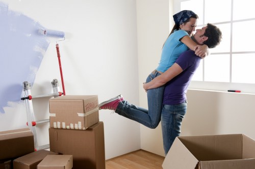 Furniture removals team planning a move in a Holland Park street