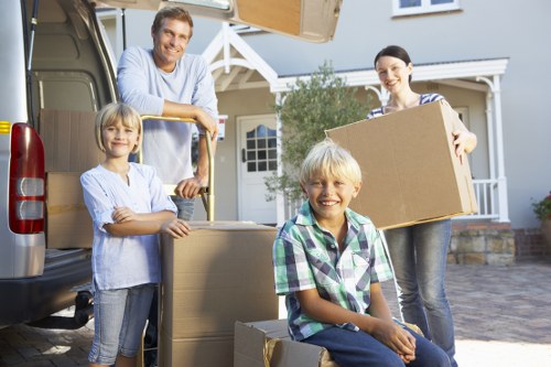 Unpacking boxes in a newly moved-in Holland Park property