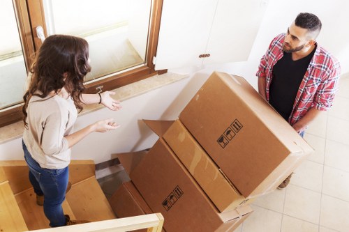 Staff safely handling furniture in a residential removal