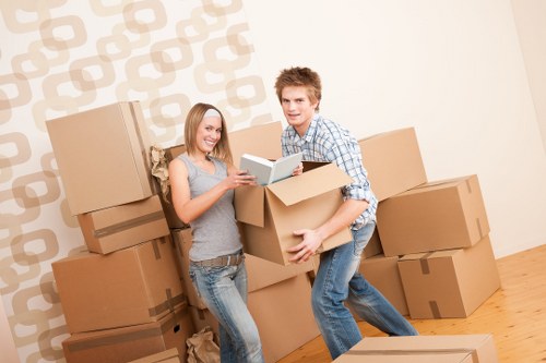 Professional movers handling a flat relocation near Holland Park