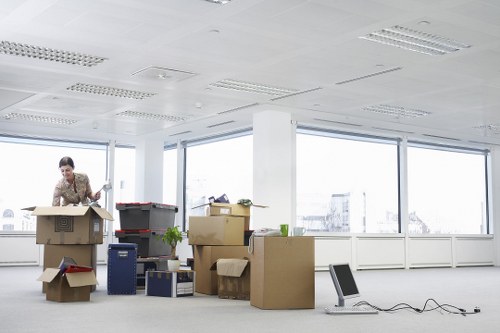 Student furniture and boxes being unloaded at a Holland Park property