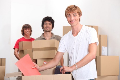 Loading items into a moving truck for a Holland Park move