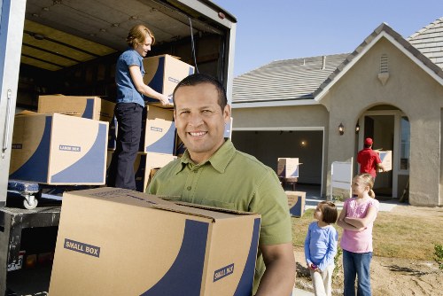 Packed boxes and furniture prepared for a Holland Park apartment move