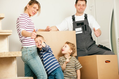 Staff using correct manual handling techniques during a move