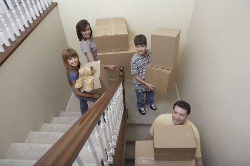 Careful loading of household furniture for transport in Holland Park
